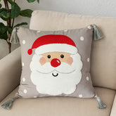 Detalle de rostro de Santa Claus en cojín decorativo